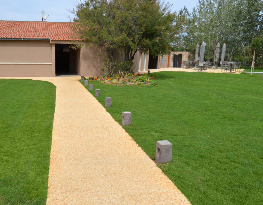 ItalianTerrazzo®, exposed aggregate paving Paglia color. Baia di Chia Resort, Domus de Maria (Italy)